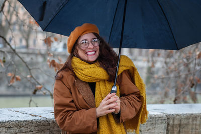 Portrait of smiling young woman in snow