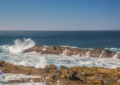 Scenic view of sea against clear sky