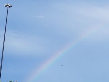 Low angle view of rainbow against sky