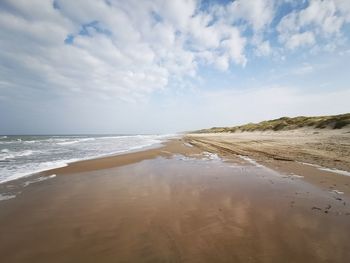 Scenic view of beach against sky