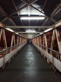 Illuminated elevated walkway at night