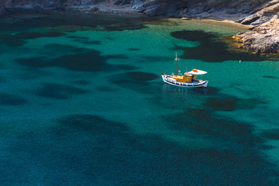 Traditional fishing boat at the beach near agios ioannis thermastis.