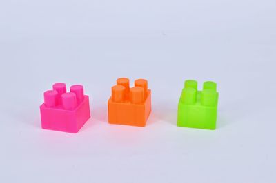 High angle view of colorful toy blocks against white background