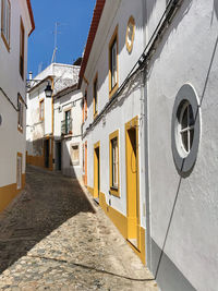 Alley amidst buildings in city