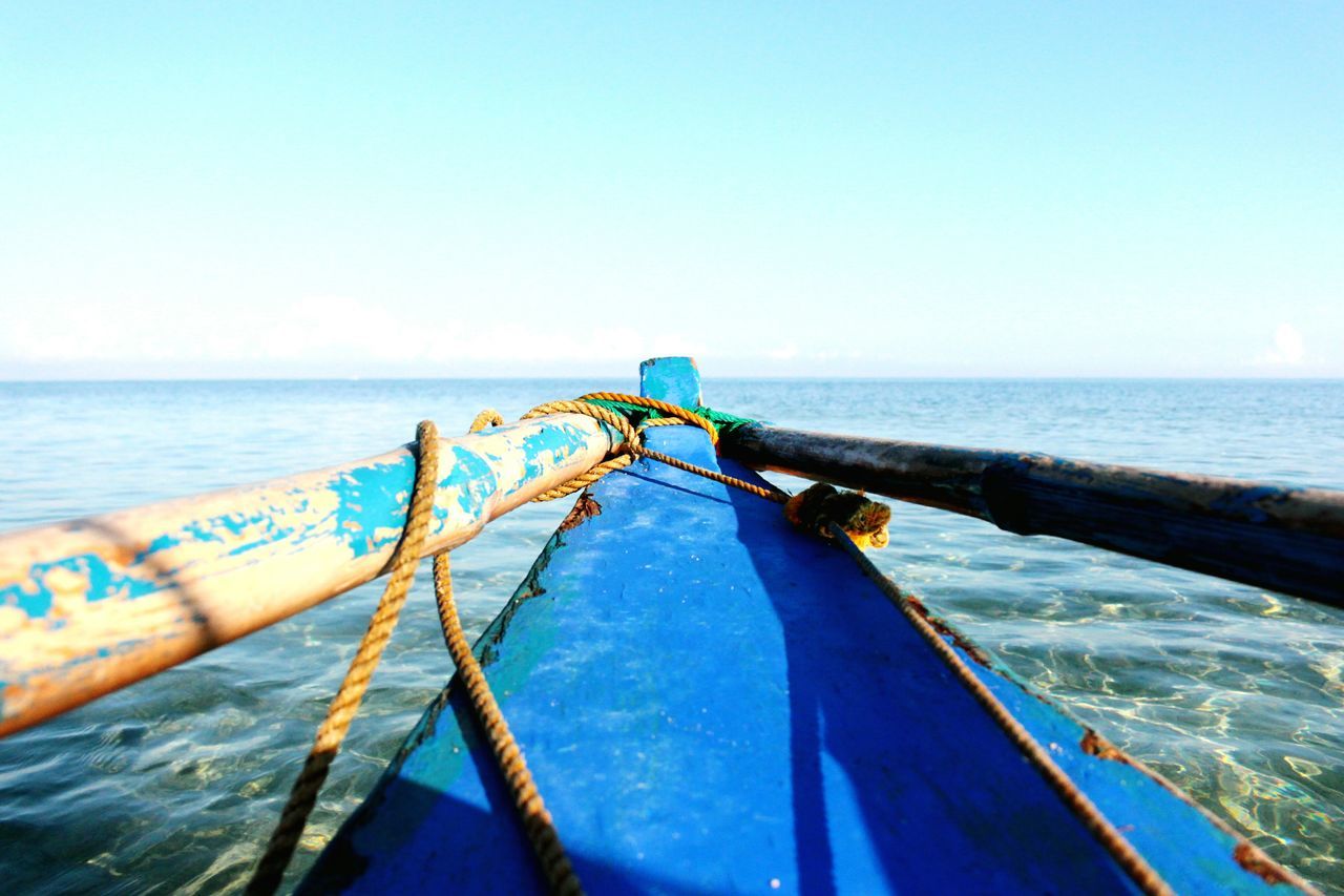 sea, horizon over water, water, clear sky, blue, nautical vessel, copy space, transportation, beach, tranquility, nature, beauty in nature, mode of transport, scenics, boat, tranquil scene, shore, day, sky, idyllic