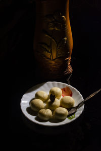 High angle view of fruits in plate on table