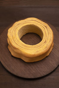 Top view of baumkuchen, sakotis ,sekacz on wooden table, traditional spit cake of lithuanian, polish