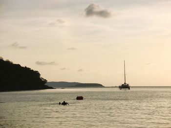 Boat sailing in sea against sky