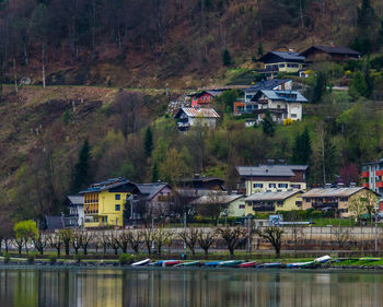 Houses by mountain against sky