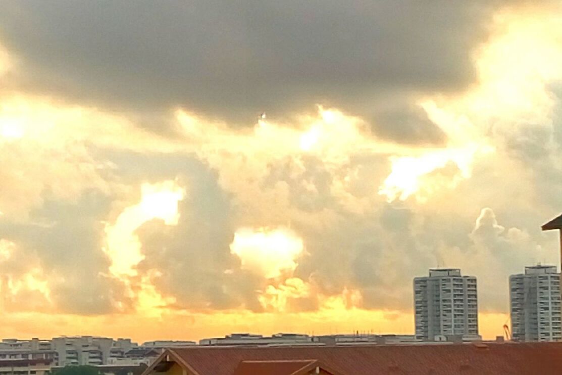 building exterior, cloud - sky, architecture, sunset, sky, built structure, cloudy, city, sun, weather, cloud, sunbeam, dramatic sky, sunlight, orange color, residential structure, cityscape, overcast, residential building, house