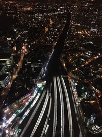 Aerial view of illuminated city at night