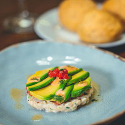 High angle view of fruits in plate on table