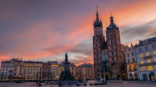 View of buildings in city at sunset, krakow, poland