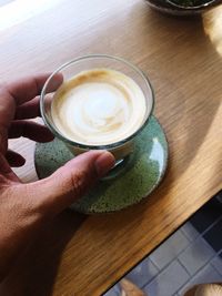 High angle view of coffee cup on table