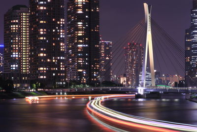 Light trails on road in city at night