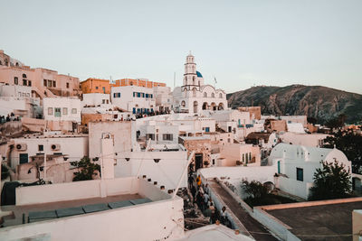 High angle view of buildings in town against sky