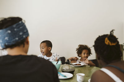 Boys eating at table