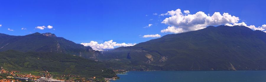 Scenic view of mountains against blue sky