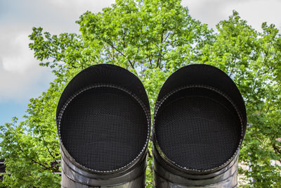 Exhaust pipes against trees