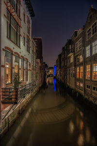 Reflection of houses in canal