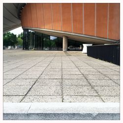 View of empty footpath in city