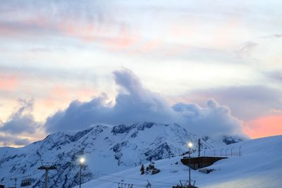 Scenic view of snow covered mountains against sky