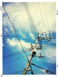 Low angle view of electricity pylon against sky