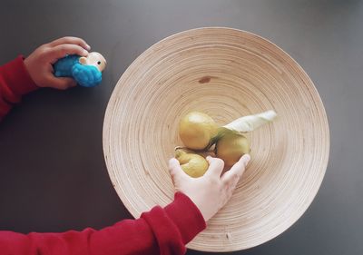 Close-up of person holding fruit