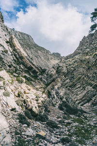 Low angle view of rock formation against sky