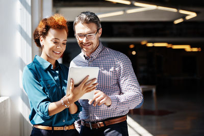 Young couple holding smart phone