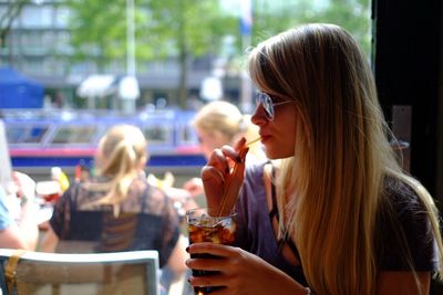 Close-up of woman sitting in restaurant