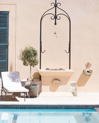 Mediterranean hotel swimming pool with well and plant