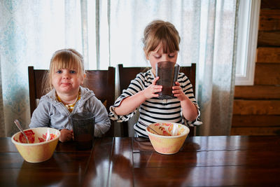 Portrait of boy sitting on table