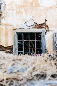 Broken window of abandoned house