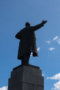 Low angle view of statue against blue sky