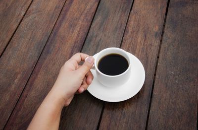 High angle view of coffee cup on table