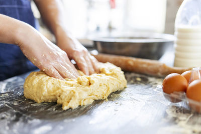 Cropped hands of person preparing food