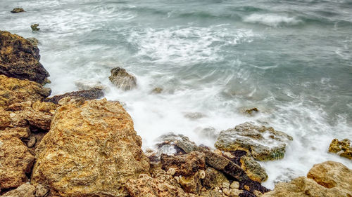 Scenic view of rocks in sea