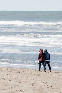 Rear view of women on beach