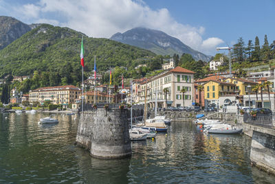 The beautiful port of menaggio with the colorful houses that are reflected on the water