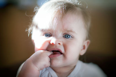 Close-up portrait of cute baby at home