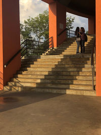 Woman standing on staircase