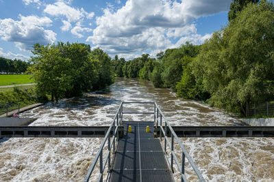 Pier over river against sky