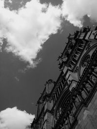 Low angle view of building against cloudy sky