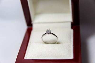 Close-up of diamond ring in jewelry box on table