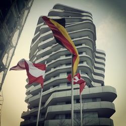 Low angle view of american flag against sky