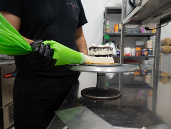 Midsection of man preparing food