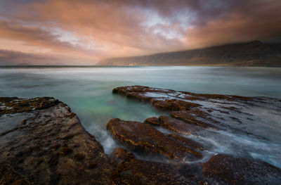 Scenic view of sea against sky during sunset