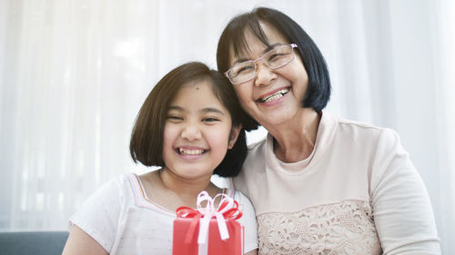 Portrait of happy girl with grandmother