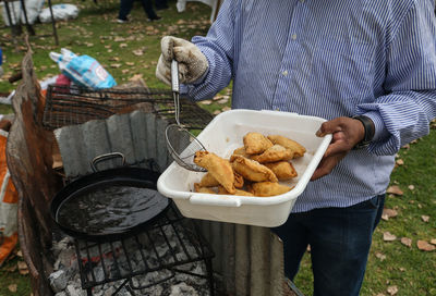 Midsection of woman holding food